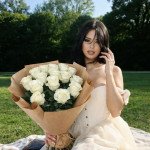Букет 15 белых роз в крафтовой упаковке